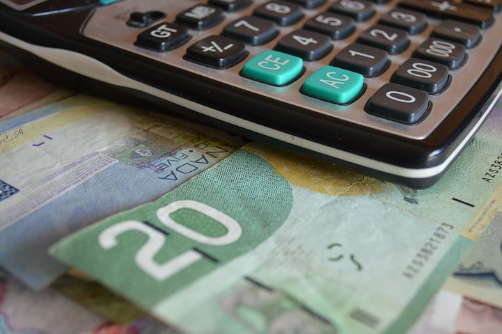 calculator and money bills