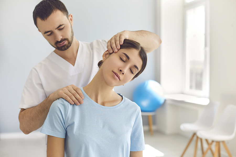 Norwest chiropractor treating a woman